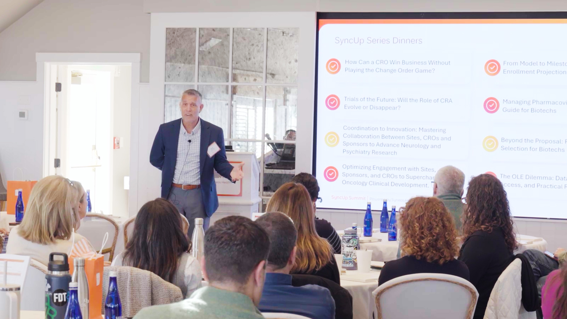 David Burnham, Senior Vice President and Managing Director of Global Client Services at Syneos Health, welcomes attendees to the 2025 SyncUp Summit held outside Boston, MA.