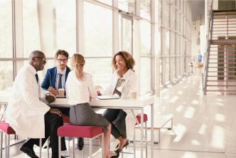 Medical professionals talking with medical affairs teams about AI implementation